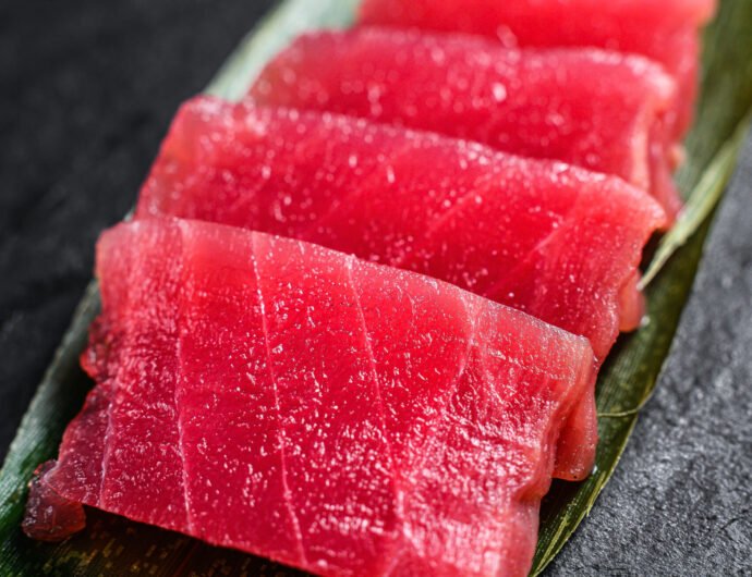 sashimi tuna on a stone Board. Black background. Top view. Close sashimi tuna on a stone Board. Black background. Top view. Close up.